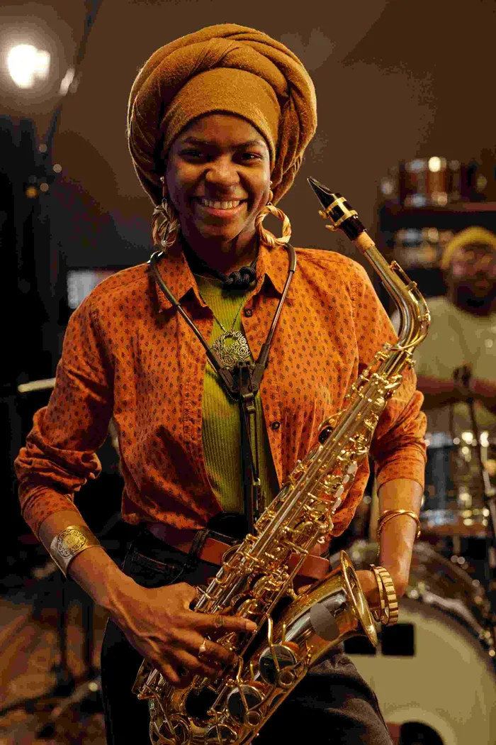 Musician holding a saxophone